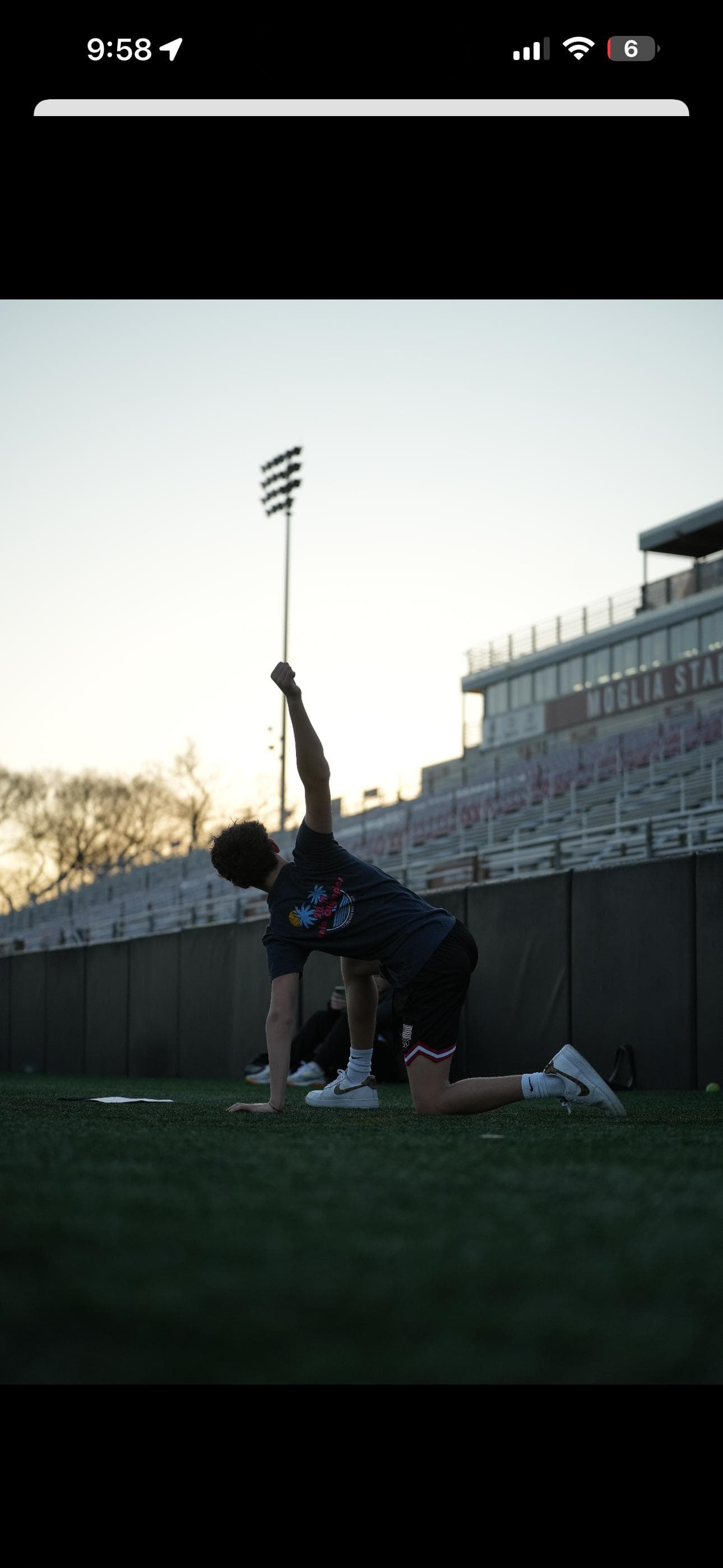 Theresa's athlete training on a field at sunset